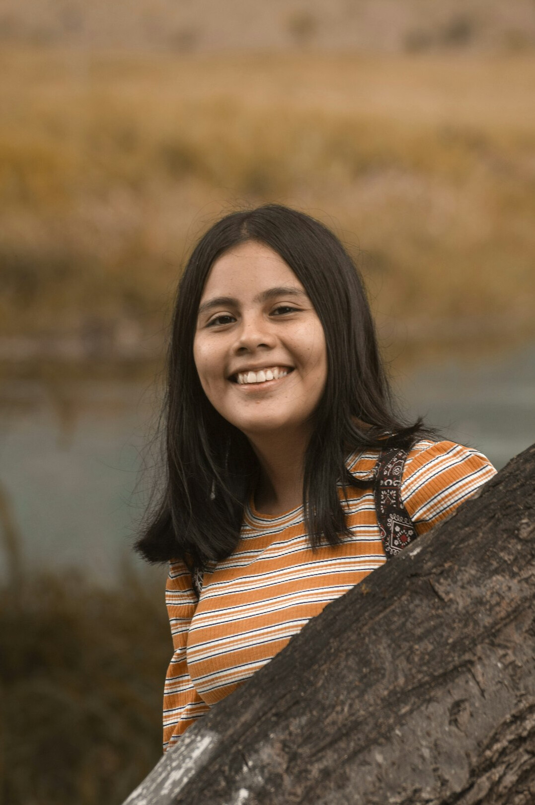 Portrait of a woman with dark hair smiling