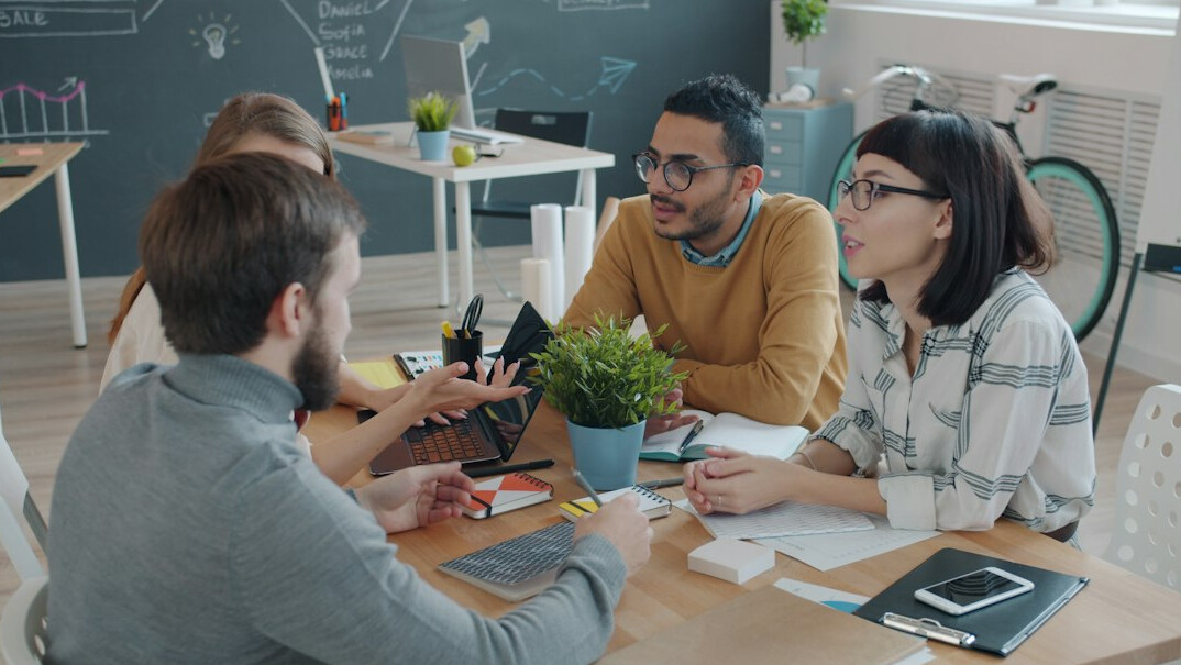 people arguing in meeting
