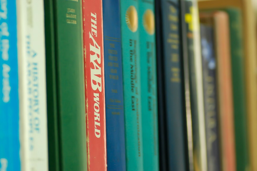 Close up of colorful book spines on a shelf