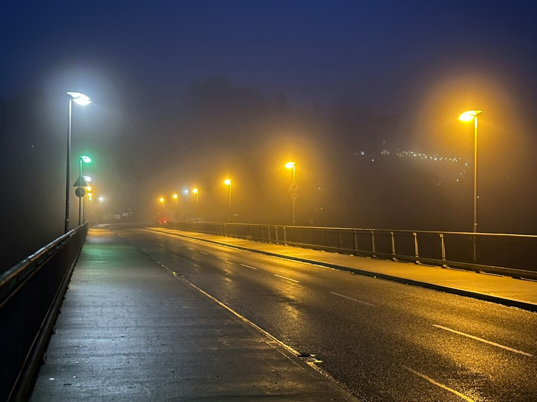 foggy city street at night