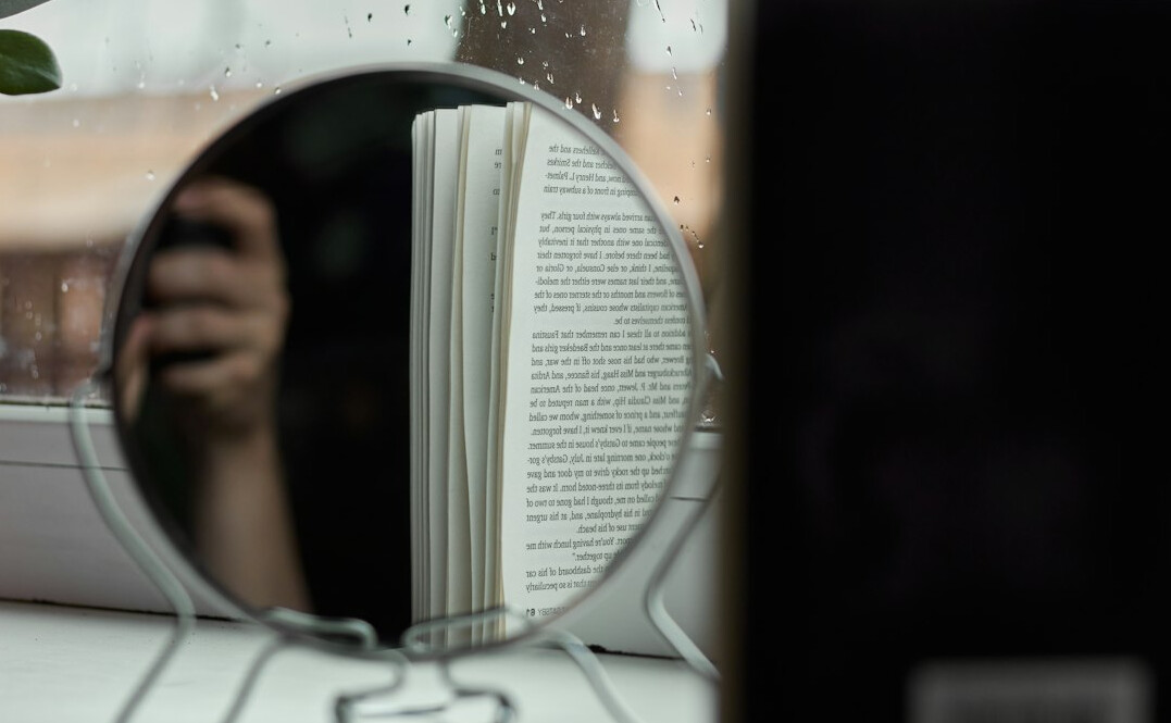 open mystery book with magnifying glass